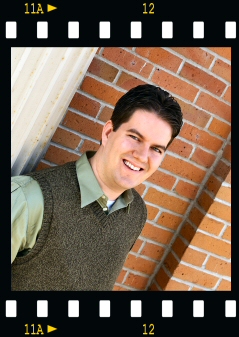 Joe standing by pillar